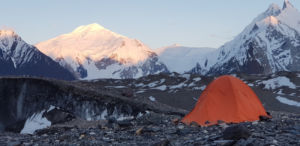 It's easy to see the benefits of a battery operated coffee maker when you are out camping in the K2 mountain like in the image.