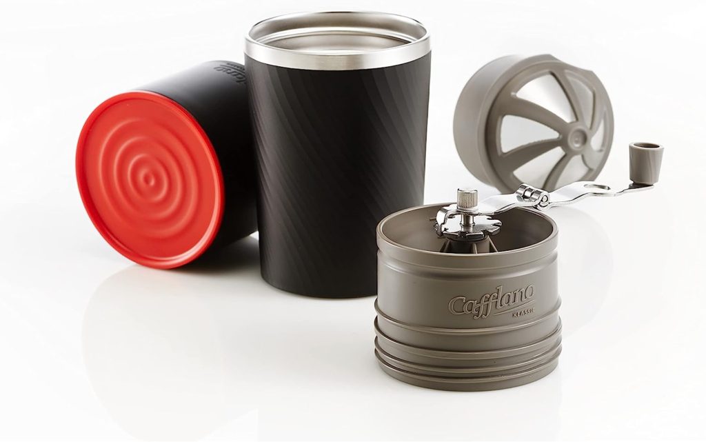 The Cafflano Klassic Portable battery operated coffee maker is shown on the image. Here you can see all the parts, the grinder the filter and the container to drink from